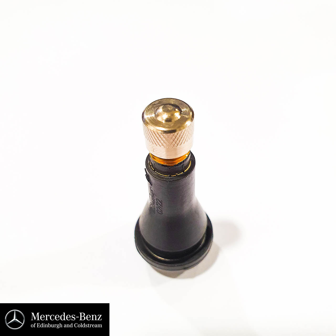 Tyre valve with metal cap