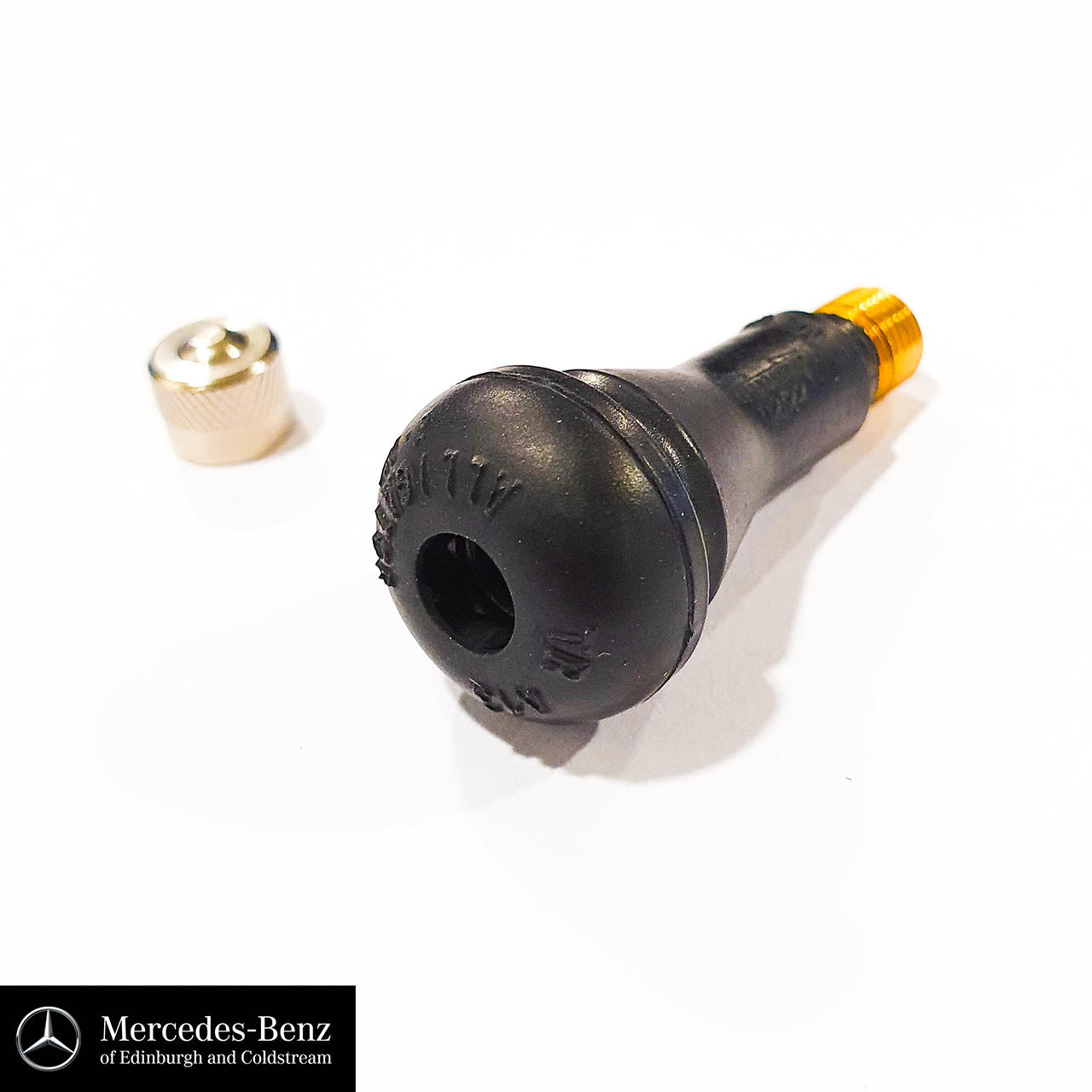 Tyre valve with metal cap
