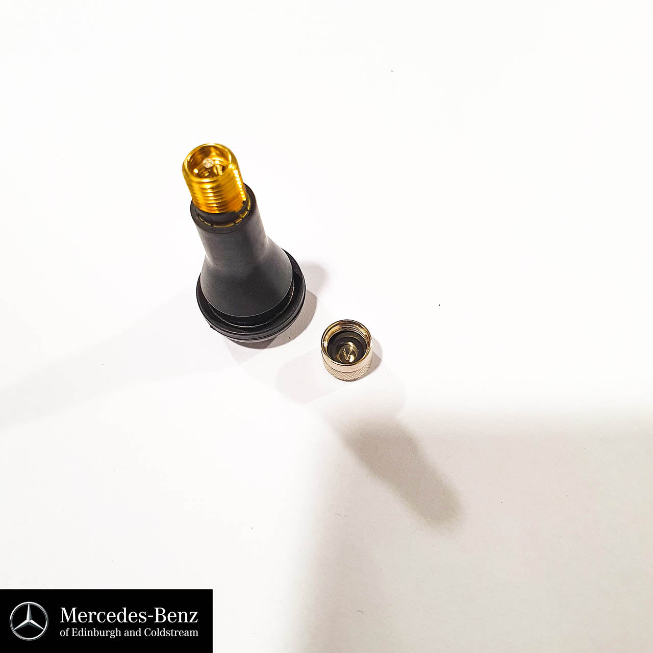 Tyre valve with metal cap
