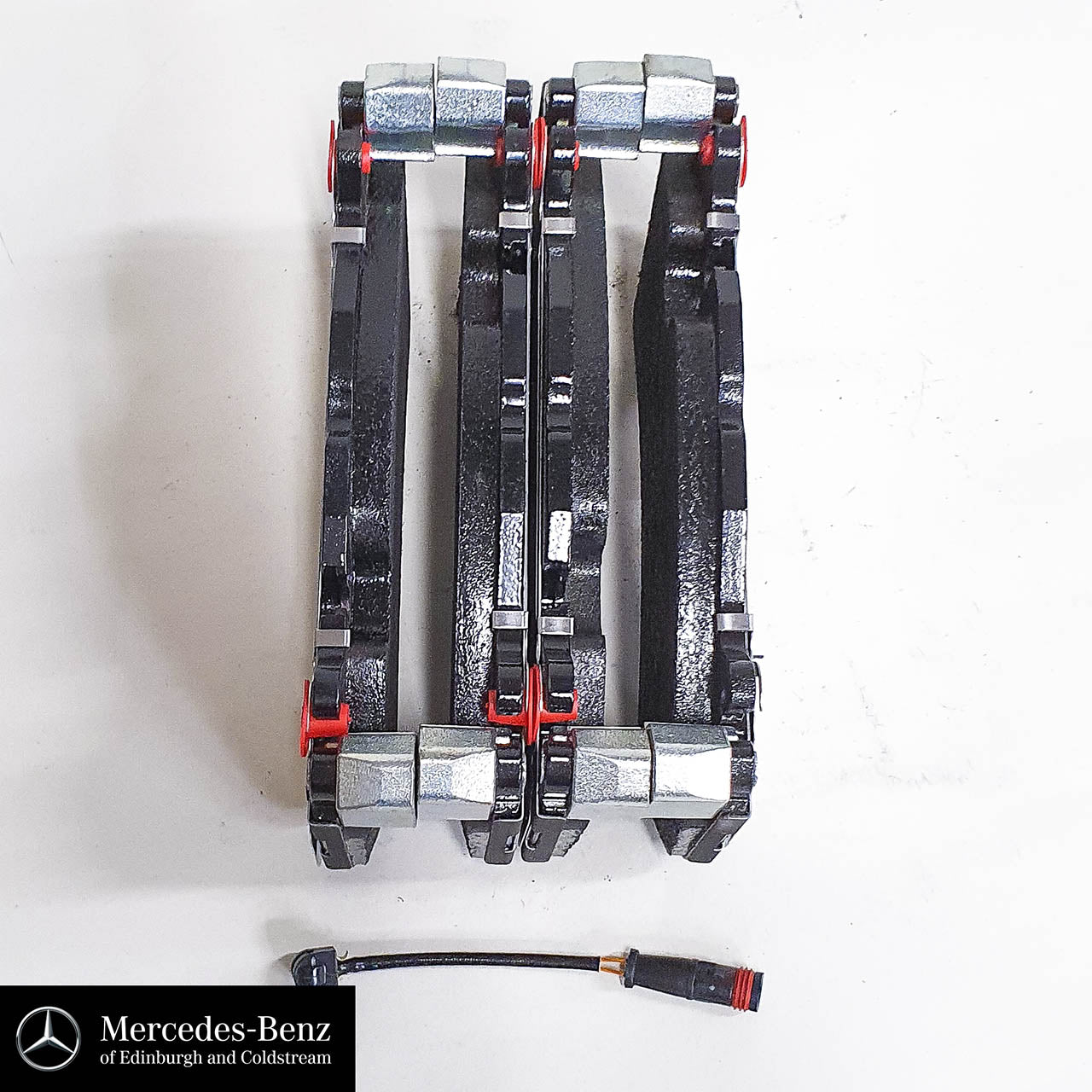 Genuine Mercedes-Benz AMG front brake pads and wear sensor